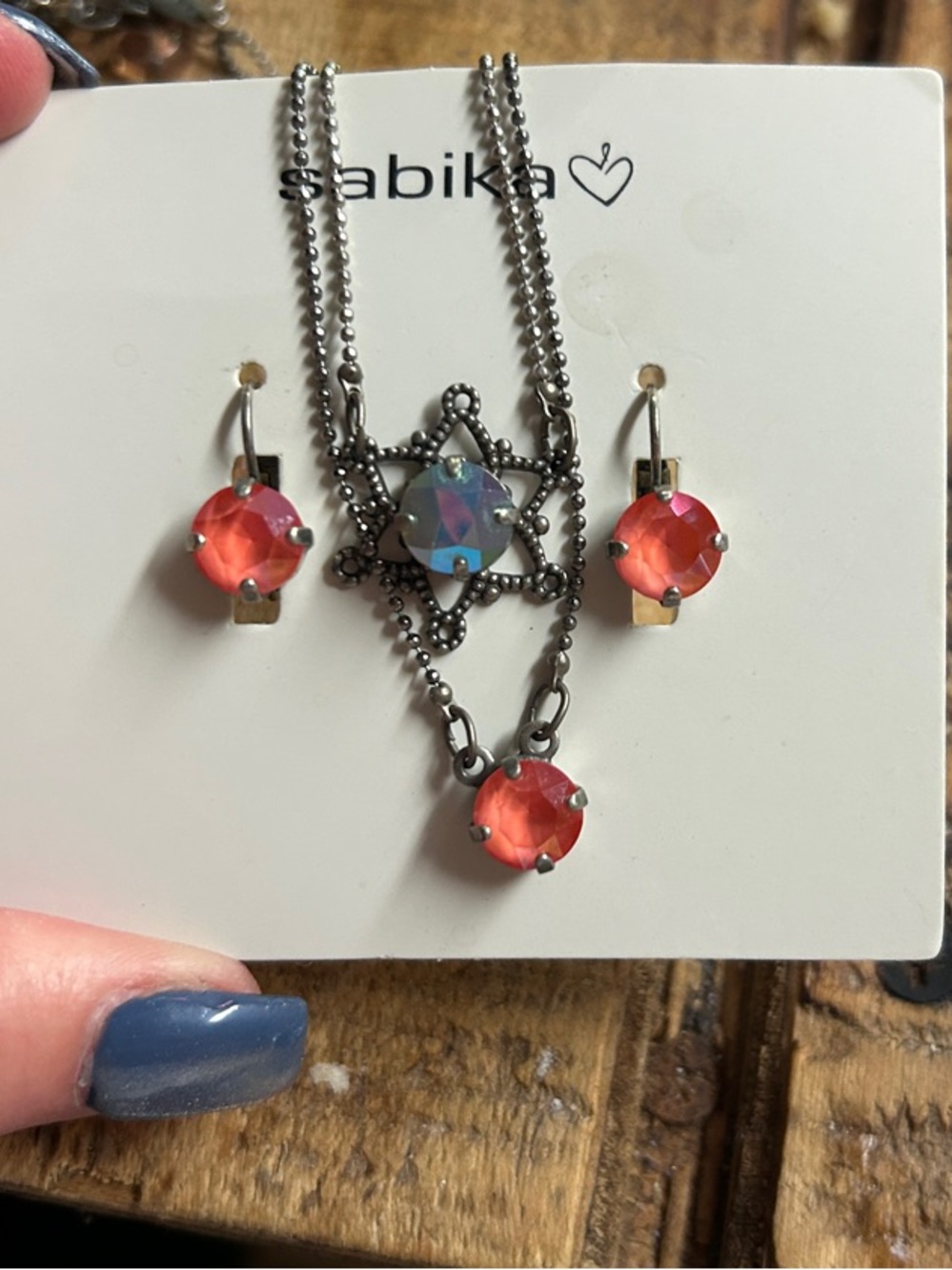 Sabika orange crystal star pendant necklace with matching drop earrings